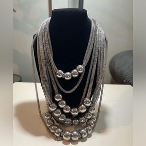Mika silver-tone signature necklace with 8 stands of mesh chains and silver ball